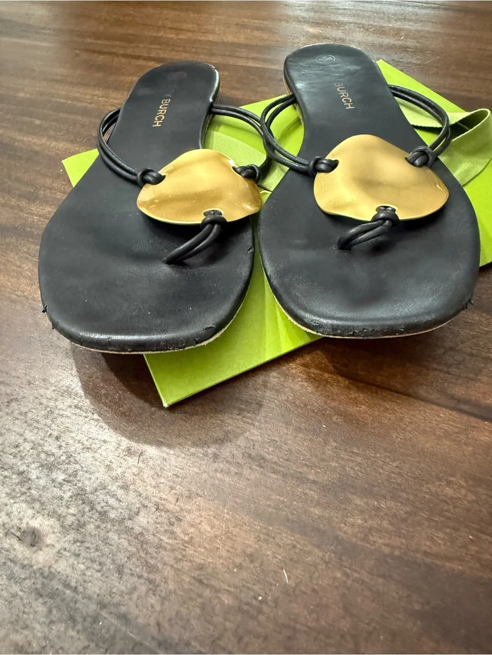 Tory Burch Patos Disk Leather Thong Sandals in black with gold-tone medallions